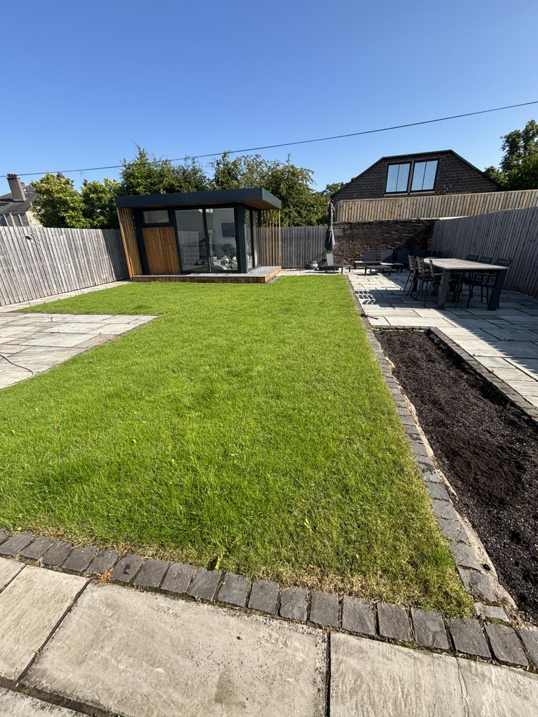 A image of a lawn that has fully recovered and looks as good as new as if it has just been re-turfed, except it hasn't it has been treated by an expert